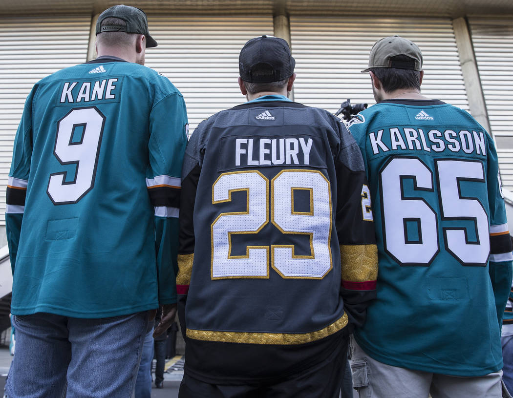 Golden Knights fan Michael Riter, middle, outside the SAP Center before the start of game one o ...