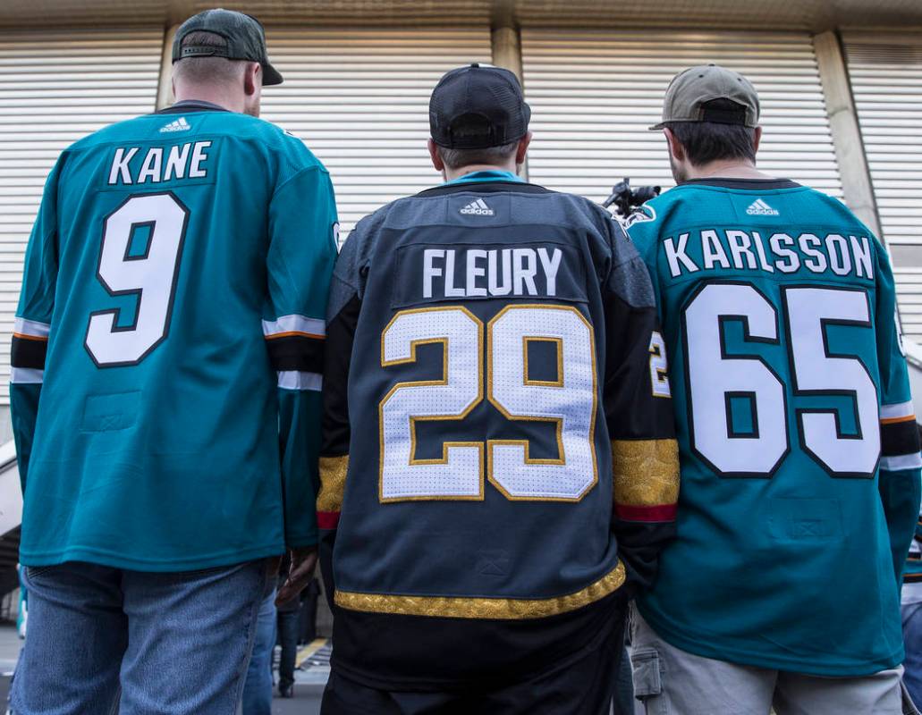 Golden Knights fan Michael Riter, middle, outside the SAP Center before the start of game one o ...