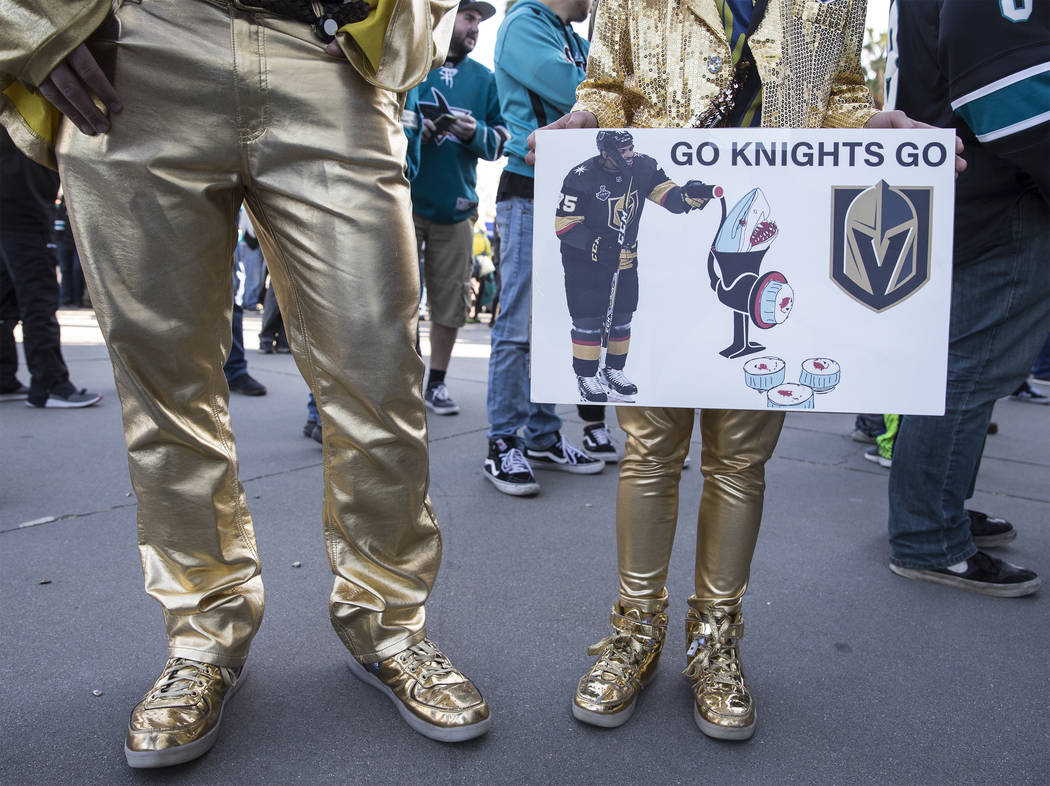 Golden Knights fans Brad Ellis, left, and daughter Madeline, 11, outside the SAP Center before ...