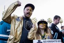 Golden Knights fans Brad Ellis, left, and daughter Madeline, 11, cheer for Vegas outside the SA ...