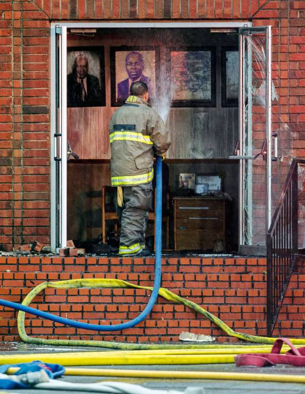 Firefighters and fire investigators respond to a fire at Mt. Pleasant Baptist Church Thursday, ...