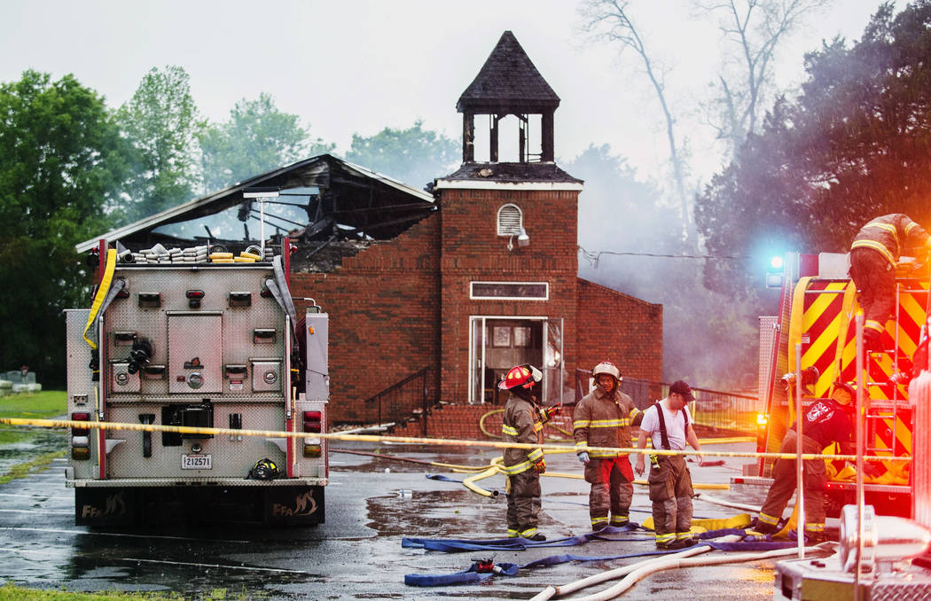 Firefighters and fire investigators respond to a fire at Mt. Pleasant Baptist Church Thursday, ...