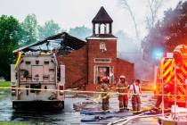 Firefighters and fire investigators respond to a fire at Mt. Pleasant Baptist Church Thursday, ...