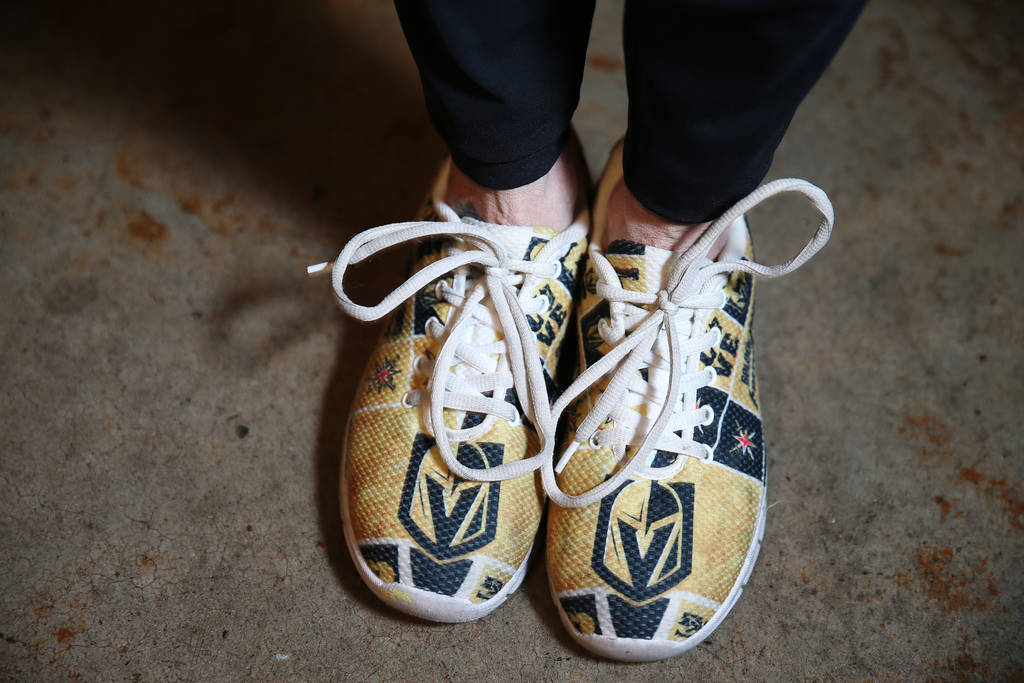Donna Rocker, co-owner of Tommy Rocker's in Las Vegas, wears Golden Knights themed shoes inside ...