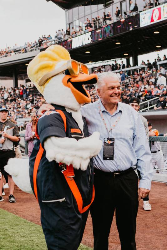 Nevada Gov. Steve Sisolak, along with Aviators mascot Spruce, greets visitors at the new ballpa ...
