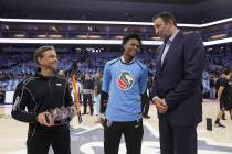 Sacramento Kings owner Vivek Ranadive, left, Kings guard De'Aaron Fox, center, and General Mang ...