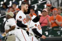 Baltimore Orioles' Chris Davis reacts after he struck out swinging during the eighth inning of ...