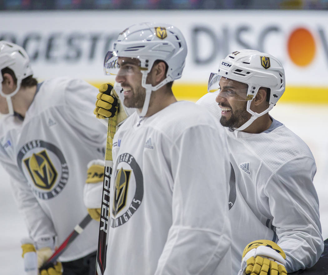 Golden Knights right wing Ryan Reaves, right, jokes around with teammate Alex Tuch during pract ...