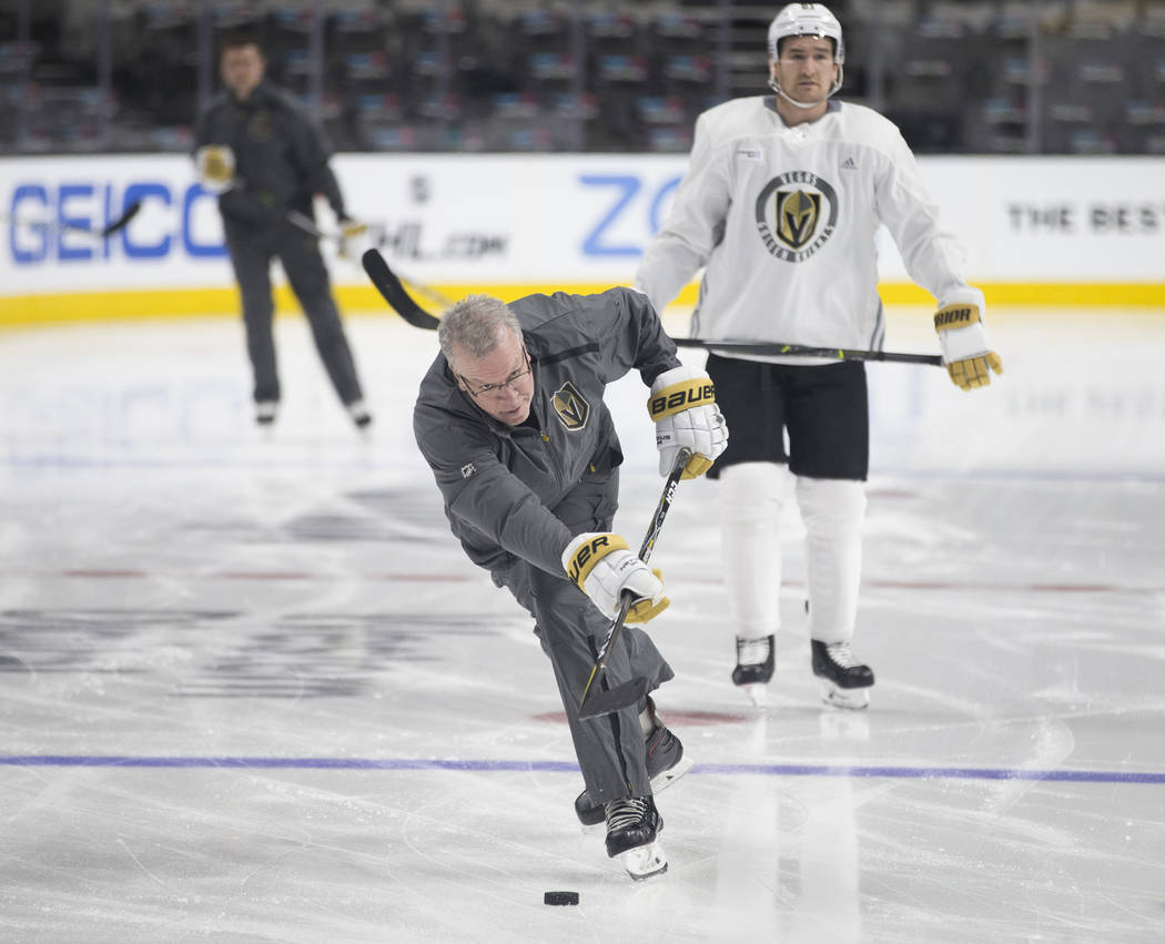 Golden Knights coach Ryan McGill warms up with his team during practice on Thursday, April 11, ...