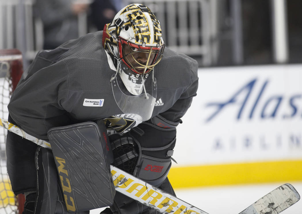 Golden Knights goaltender Malcolm Subban (30) peers out of his mask during practice on Thursday ...
