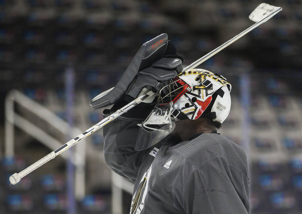 Golden Knights goaltender Malcolm Subban (30) adjusts his mask during practice on Thursday, Apr ...
