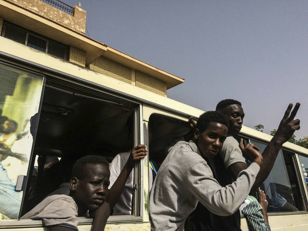 Protesters celebrate in Khartoum, Sudan, Thursday, April 11, 2019. Tens of thousands of Sudanes ...