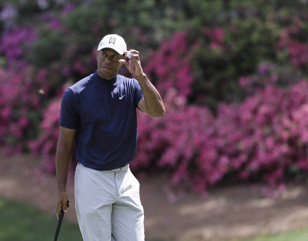 Tiger Woods on the 13th hole during the first round for the Masters golf tournament Thursday, A ...