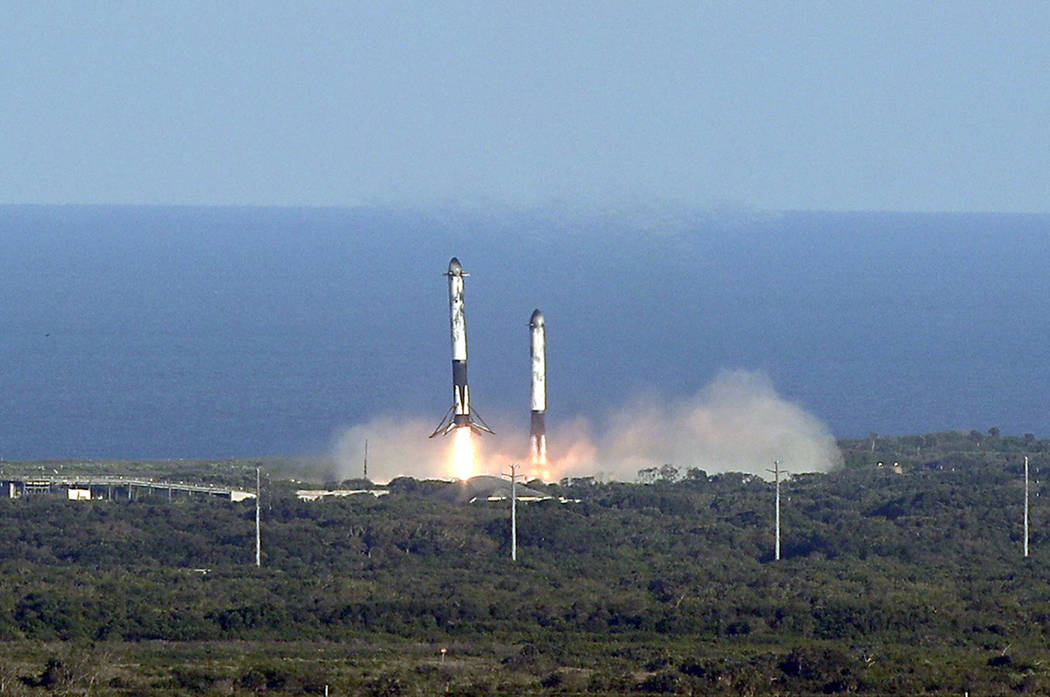 Eight minutes after liftoff, SpaceX lands two of the first-stage boosters side by side at the K ...