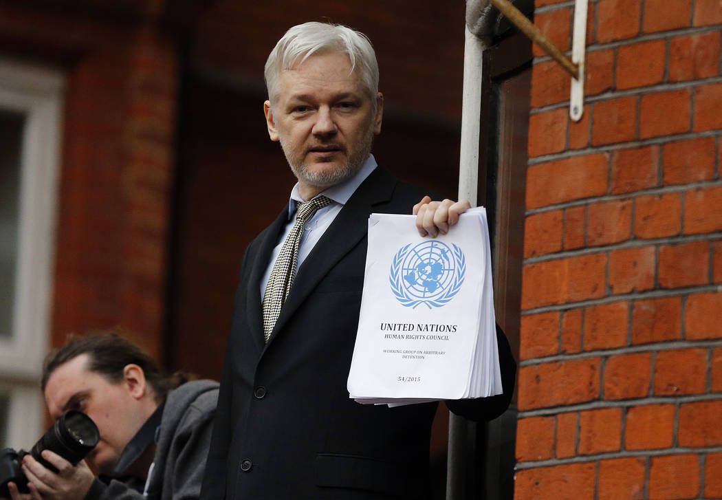 FILE - In this Friday, Feb. 5, 2016 file photo, WikiLeaks founder Julian Assange stands on the ...