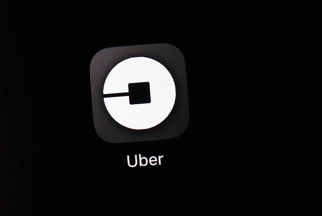 FILE - This March 20, 2018, file photo shows the Uber app on an iPad in Baltimore. Uber is prov ...