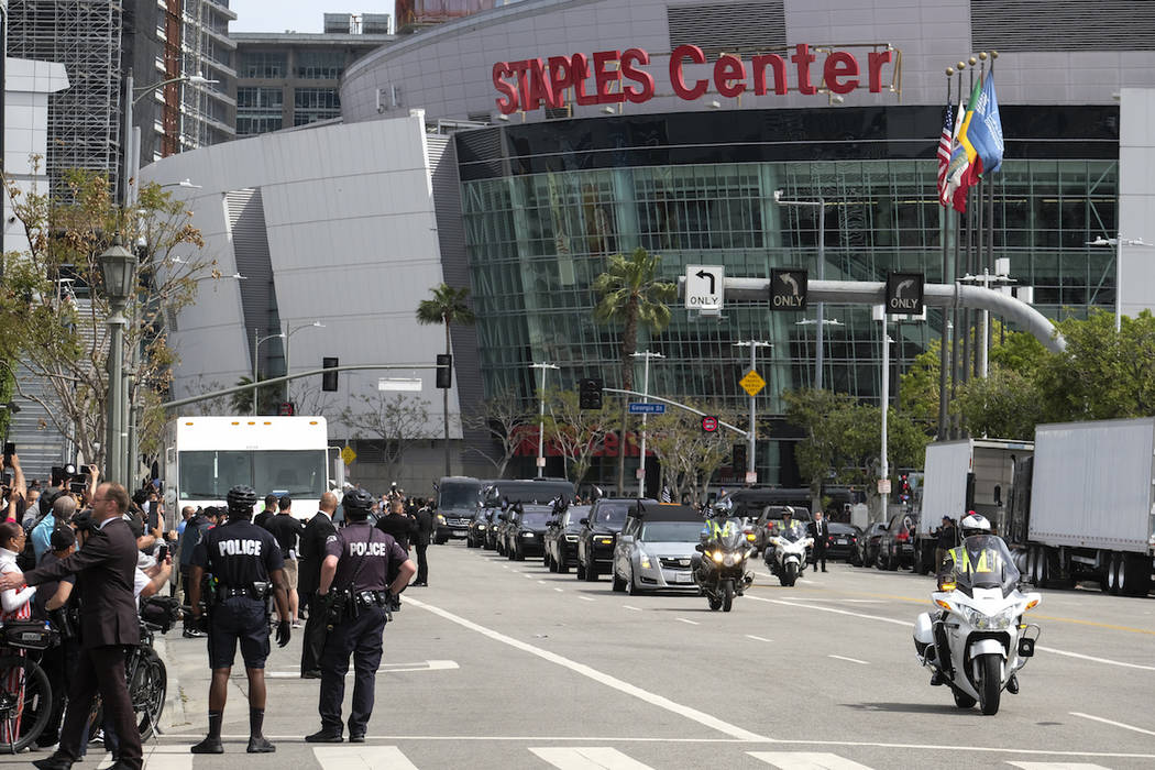 The hearse carrying rapper Nipsey Hussle leaves Staples Center after a public memorial in Los A ...