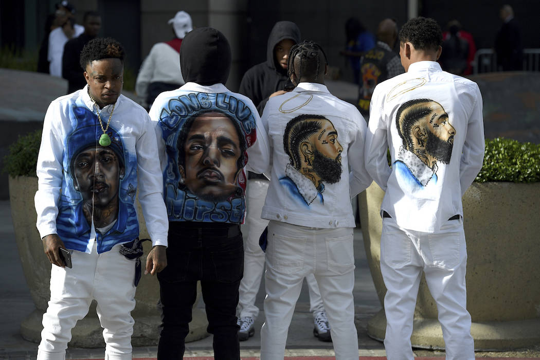 Slum Baby, from left, Yhung To, Lil Cadi PGE and Lo, from the Crenshaw neighborhood of Los Ange ...