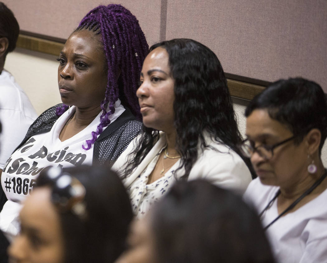 Family and friends of the victims of two Arbor View High School teenage suspects accused of a h ...