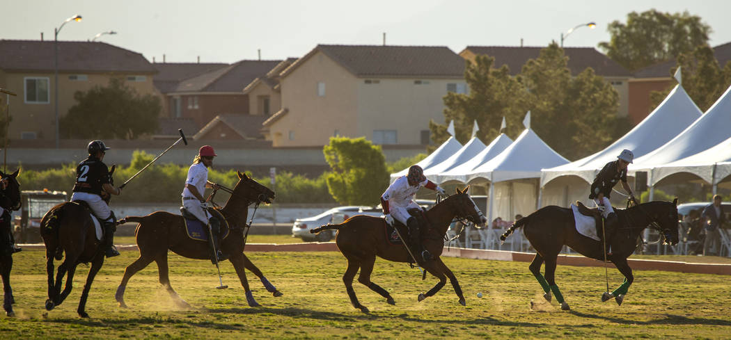 Blue Heron battles UBS Financial Services during their match at the Las Vegas Polo Classic at S ...