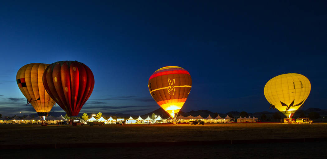 A balloon glow completes the night to live music during the Las Vegas Polo Classic at Star Nurs ...