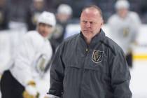 Golden Knights head coach Gerard Gallant warms up with his team during morning skate on Friday, ...