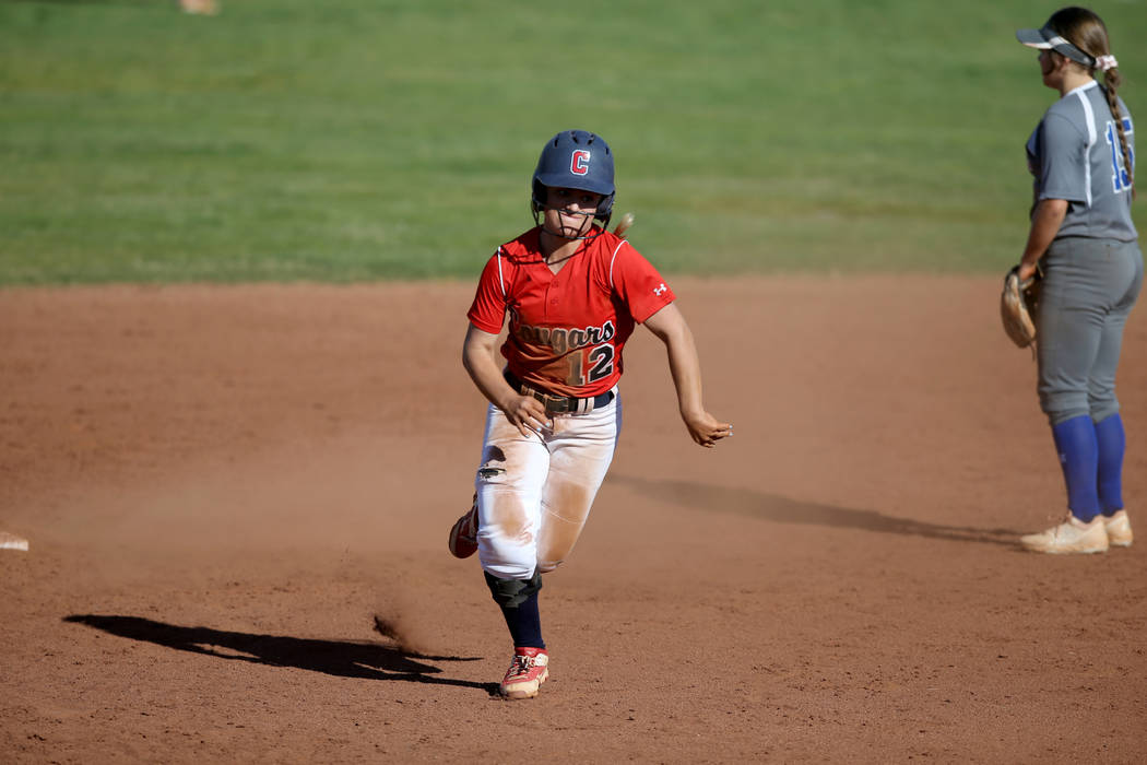 Coronado shortstop Paige Sinicki (12) heads for third base during a softball game against Basic ...