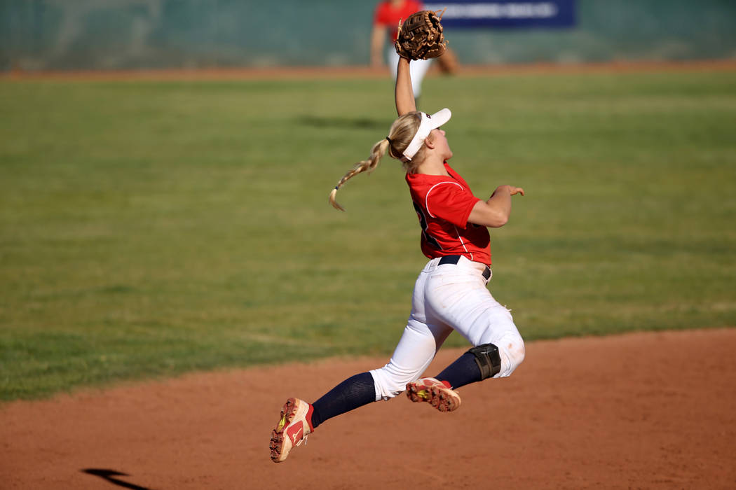 Coronado shortstop Paige Sinicki (12) jumps for a Basic line drive during their softball game a ...