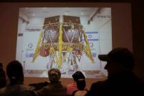 People watch the live broadcast of the SpaceIL spacecraft as it lost contact with Earth in Neta ...