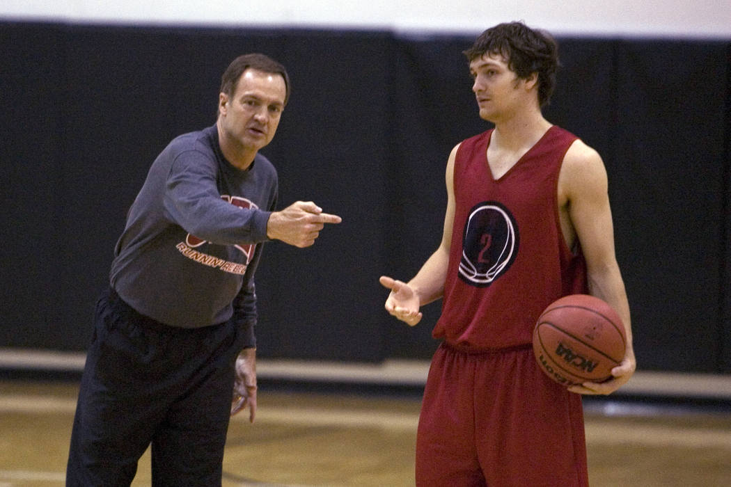 K.M. CANNON/REVIEW-JOURNAL UNLV Head Coach Lon Kruger gives instruction is son, point guard Kev ...
