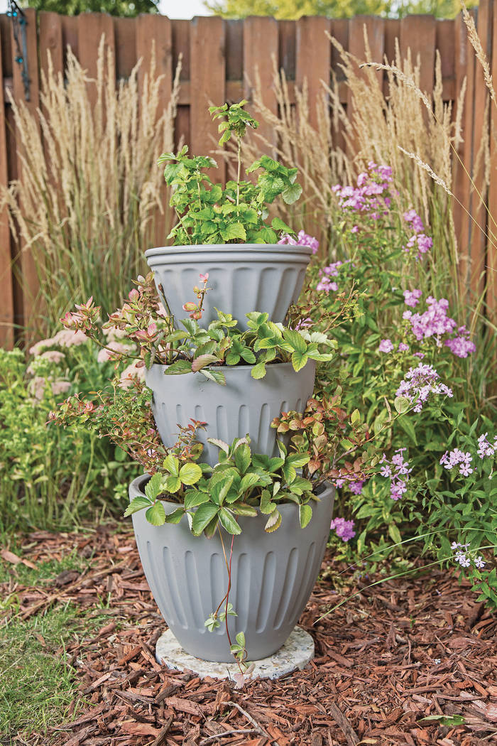 What better way to put those extra planters to use than to create a stocked pot tower garden? N ...