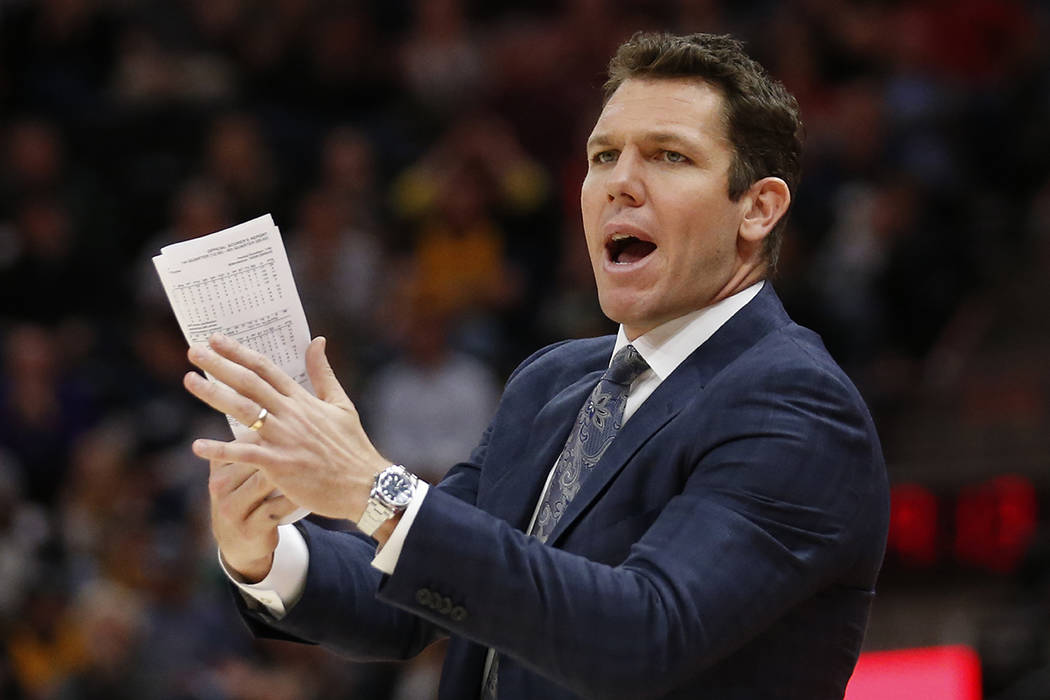 Los Angeles Lakers head coach Luke Walton shouts to his team in the second half during an NBA b ...