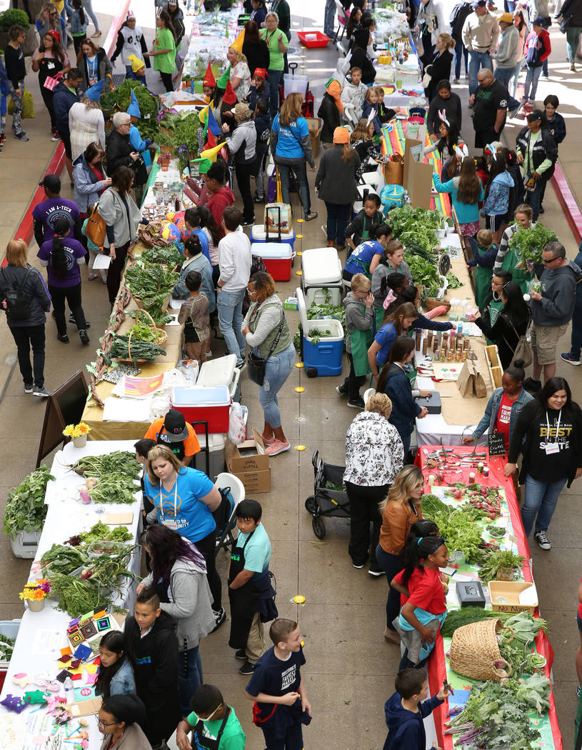 The Clark County School students sale their produce at Green Our Planet's Giant Student Farmers ...