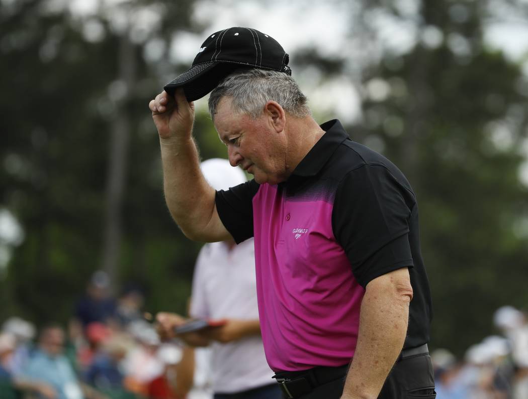 Ian Woosnam, of Wales, tips his hat as he walks off the 18th hole during the second round for t ...