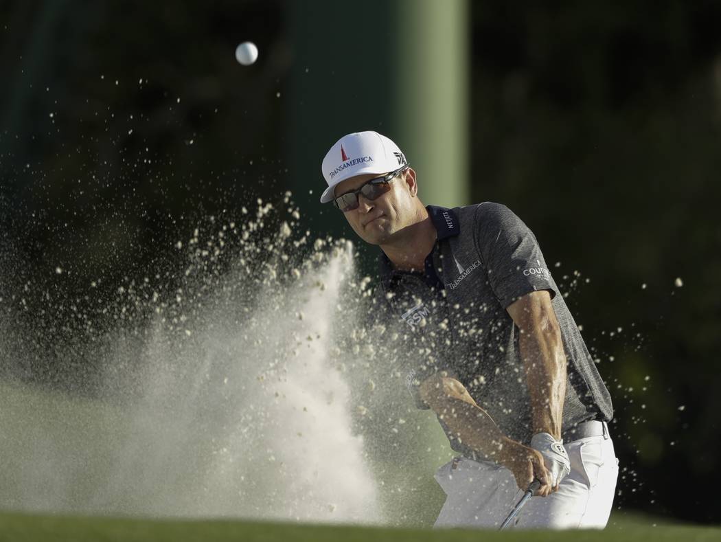 Zach Johnson hits on the 18th hole during the first round for the Masters golf tournament Thurs ...