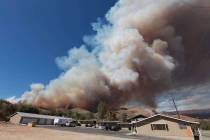 In this Monday, Aug. 18, 2014, file photo, smoke rises from a fire in Wofford Heights, Calif. T ...