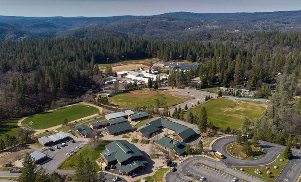 In this March 14, 2019, photo, Colfax, Calif.'s elementary and high schools are surrounded by t ...