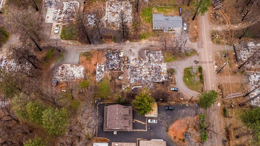 In this March 19, 2019 photo, an aerial image shows the home of Sean and Dawn Herr, bottom cent ...