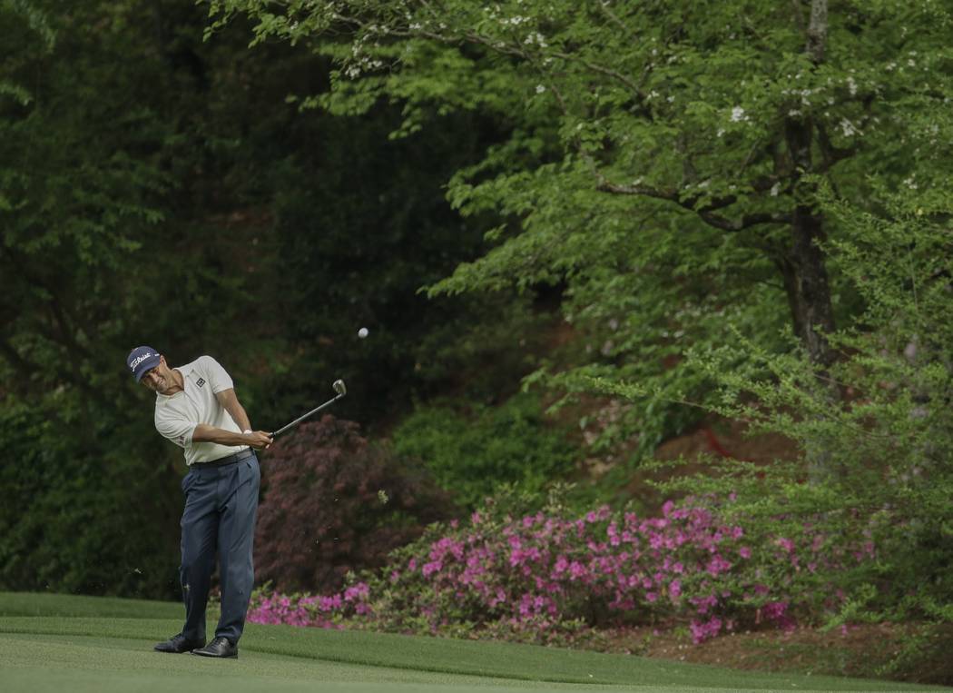 Adam Scott, of Australia, hits on the 13th hole during the second round for the Masters golf to ...