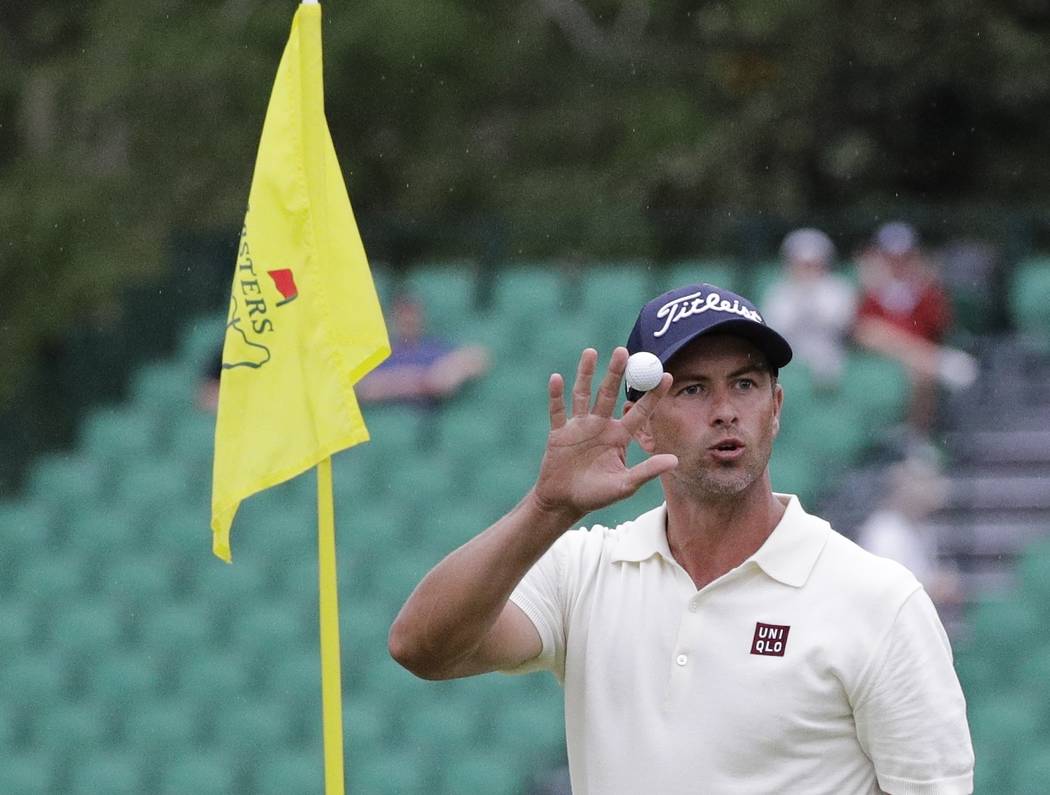 Adam Scott, of Australia, waves after his eagle on the 15th hole during the second round for th ...