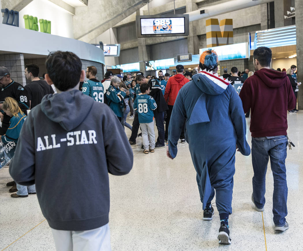 San Jose Sharks fans make their way to their seats before the start of Game 2 of an NHL Western ...
