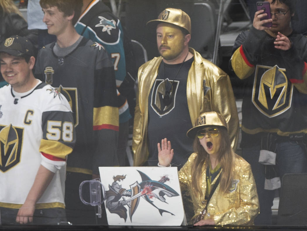 Golden Knights fan Madeline Ellis, right, 11, cheers for Vegas during warmups before the start ...