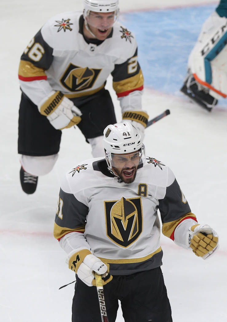 Golden Knights center Pierre-Edouard Bellemare (41) celebrates with teammate Paul Stastny (26) ...