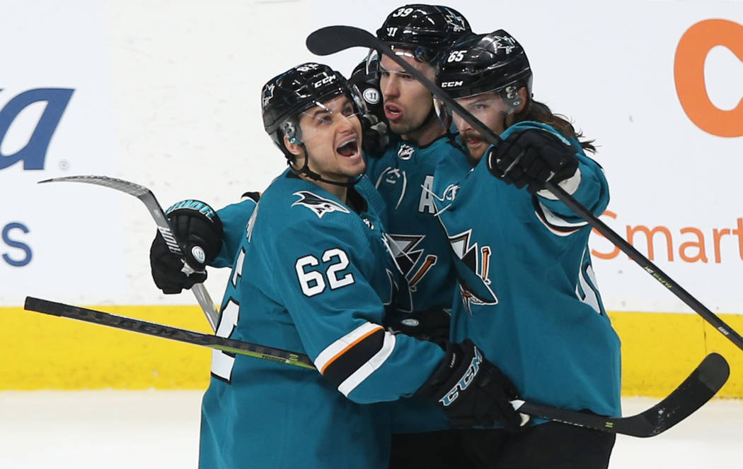 San Jose Sharks right wing Kevin Labanc (62) celebrates with teammates after center Logan Coutu ...