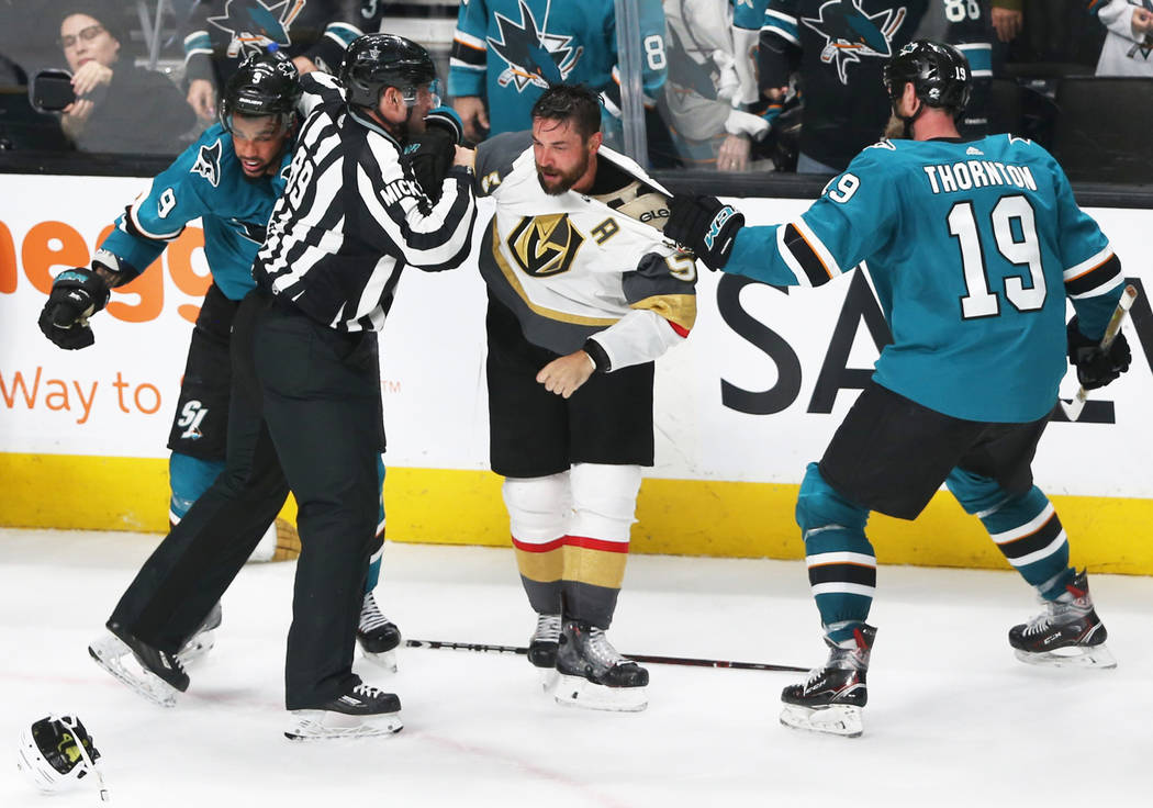 San Jose Sharks left wing Evander Kane (9) and center Joe Thornton (19) fight with Golden Knigh ...