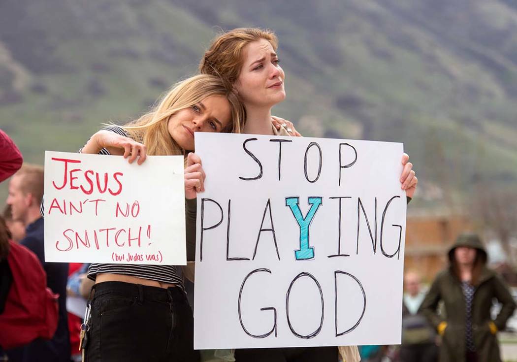 Tyler Glade and Zoe Calcote stand for a moment of silence, as the they gather on the campus of ...