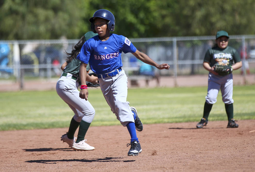 Rangers' Jay Jay Nichols, 12, runs to third base against the Bulldogs during the opening day ce ...