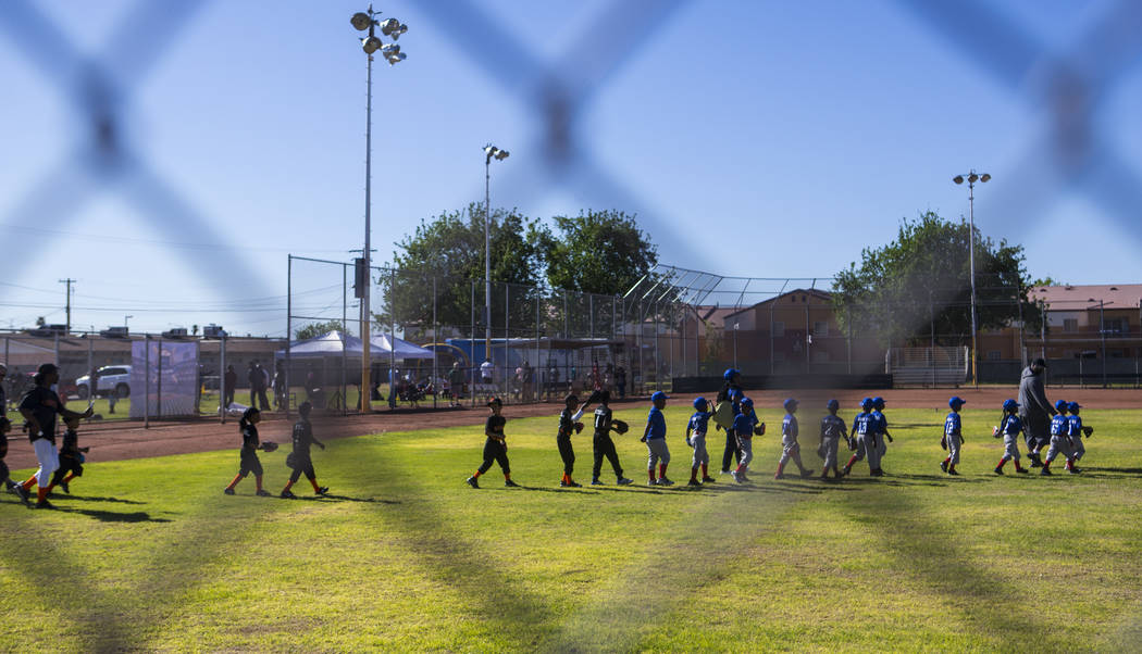Players walk out onto the field during the opening day celebration for the third season of Bold ...