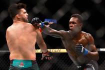 Kelvin Gastelum and Israel Adesanya fight during a middleweight mixed martial arts bout at UFC ...