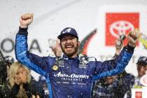 Martin Truex Jr. (19) celebrates winning the NASCAR Cup series auto race at Richmond Raceway in ...
